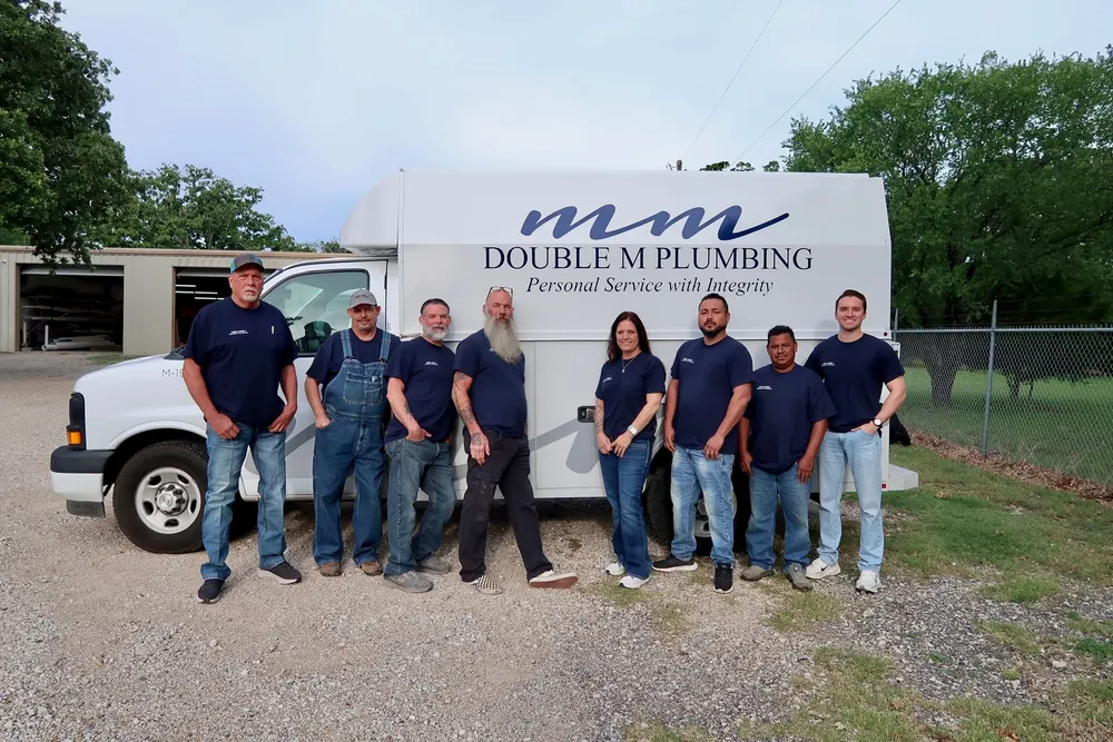 Professional plumber working on water heater installation